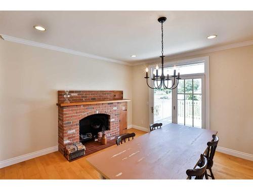 179 E 100 S, Raymond, AB - Indoor Photo Showing Other Room With Fireplace