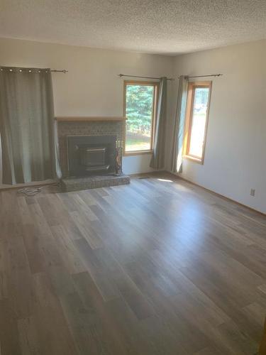 508 6Th Avenue, Warner, AB - Indoor Photo Showing Living Room With Fireplace