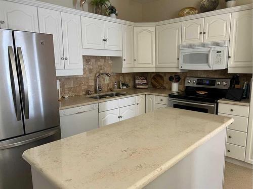 1237 Glacier Drive South, Lethbridge, AB - Indoor Photo Showing Kitchen With Double Sink