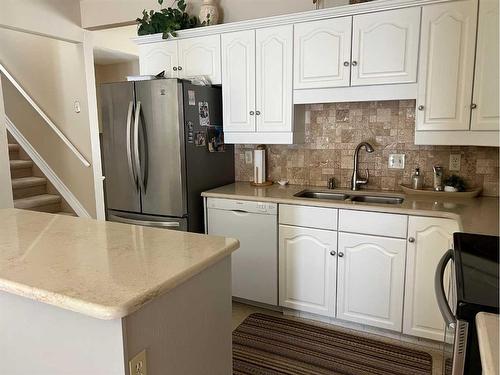 1237 Glacier Drive South, Lethbridge, AB - Indoor Photo Showing Kitchen With Double Sink