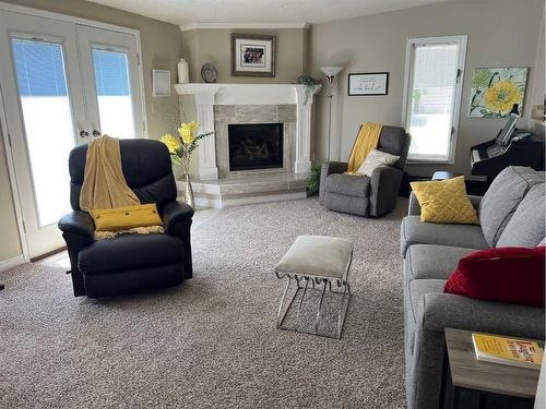 1237 Glacier Drive South, Lethbridge, AB - Indoor Photo Showing Living Room With Fireplace