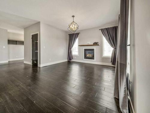 4721 7 Street, Coalhurst, AB - Indoor Photo Showing Living Room With Fireplace