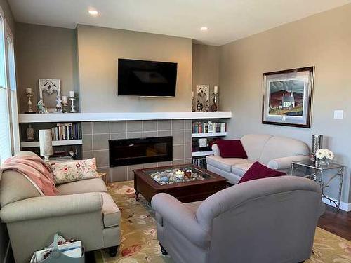 170 Crocus Terrace West, Lethbridge, AB - Indoor Photo Showing Living Room With Fireplace