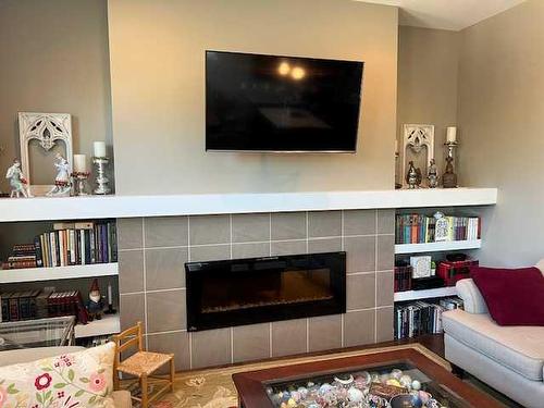 170 Crocus Terrace West, Lethbridge, AB - Indoor Photo Showing Living Room With Fireplace