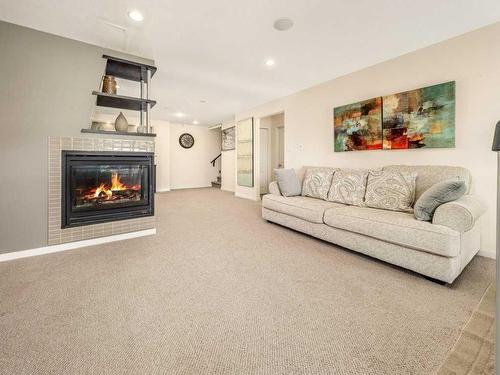 1628 Coalbanks Boulevard West, Lethbridge, AB - Indoor Photo Showing Living Room With Fireplace