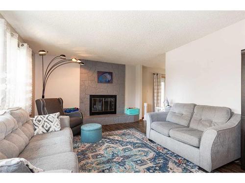 165 Lakhota Crescent West, Lethbridge, AB - Indoor Photo Showing Living Room With Fireplace