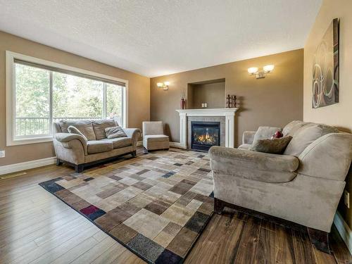 533 Sunridge Crescent West, Lethbridge, AB - Indoor Photo Showing Living Room With Fireplace