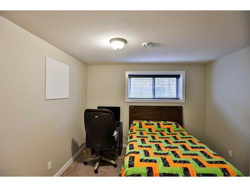 35 Church Avenue, Raymond, AB - Indoor Photo Showing Bedroom