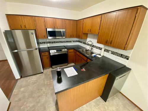 3608-3610 20 Avenue South, Lethbridge, AB - Indoor Photo Showing Kitchen With Double Sink