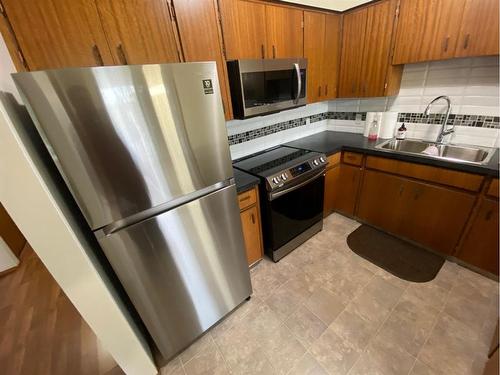 3608-3610 20 Avenue South, Lethbridge, AB - Indoor Photo Showing Kitchen With Double Sink