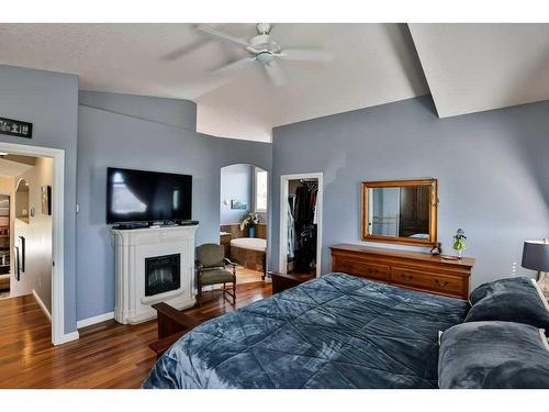 136 Fairway Drive, Coaldale, AB - Indoor Photo Showing Bedroom With Fireplace