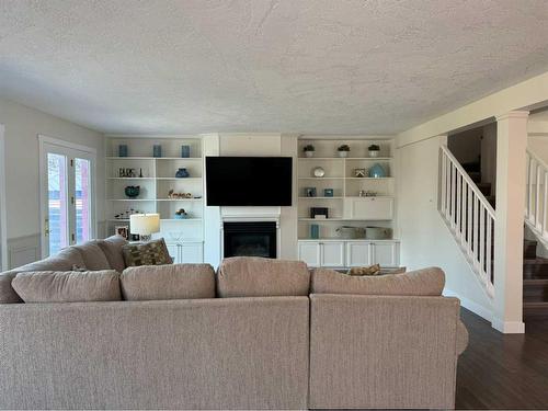 1276 Thistle Crescent, Pincher Creek, AB - Indoor Photo Showing Living Room With Fireplace