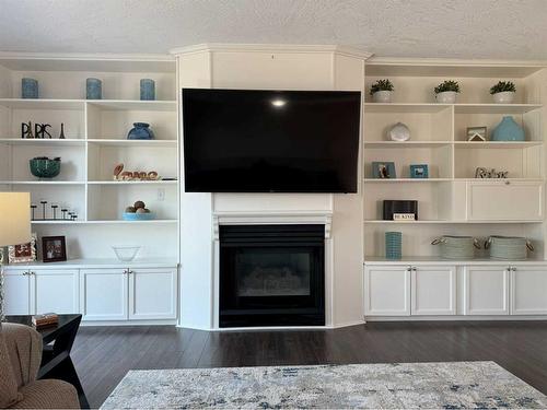 1276 Thistle Crescent, Pincher Creek, AB - Indoor Photo Showing Living Room With Fireplace