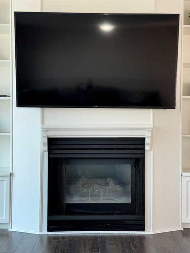 1276 Thistle Crescent, Pincher Creek, AB - Indoor Photo Showing Living Room With Fireplace