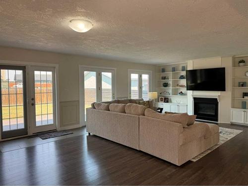 1276 Thistle Crescent, Pincher Creek, AB - Indoor Photo Showing Living Room With Fireplace