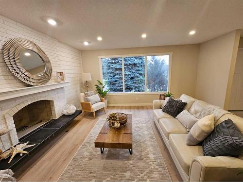 1733 Lakeshore Road South, Lethbridge, AB - Indoor Photo Showing Living Room With Fireplace