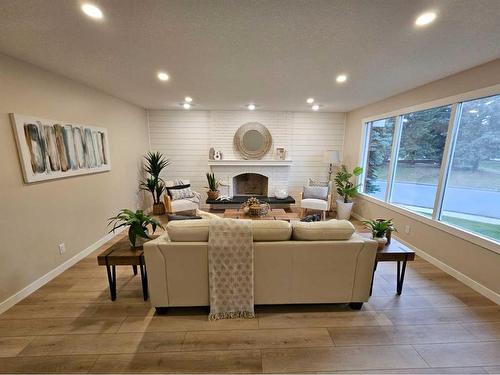 1733 Lakeshore Road South, Lethbridge, AB - Indoor Photo Showing Living Room With Fireplace