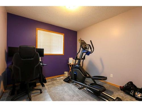 6002 Park Place, Taber, AB - Indoor Photo Showing Gym Room