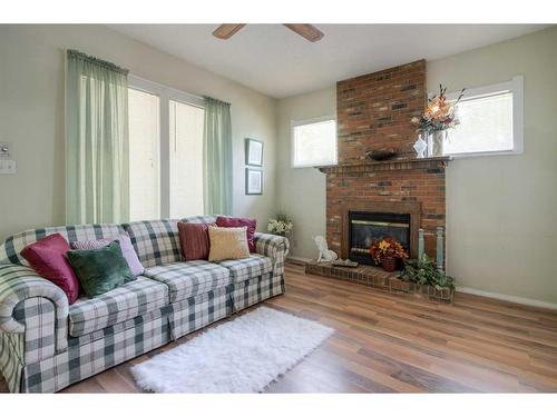 602 12C Street North, Lethbridge, AB - Indoor Photo Showing Living Room With Fireplace