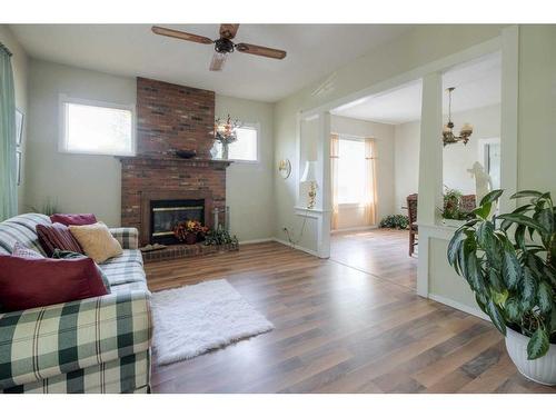 602 12C Street North, Lethbridge, AB - Indoor Photo Showing Living Room With Fireplace