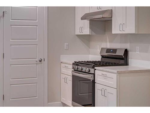 12730 19 Avenue, Blairmore, AB - Indoor Photo Showing Kitchen With Double Sink