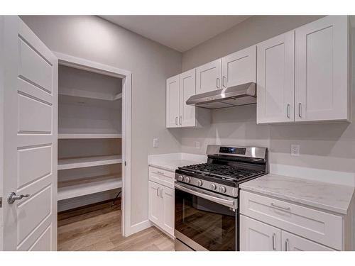 12730 19 Avenue, Blairmore, AB - Indoor Photo Showing Kitchen With Double Sink