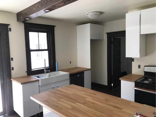 806 7 Avenue South, Lethbridge, AB - Indoor Photo Showing Kitchen With Double Sink