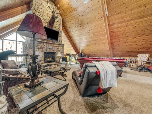 208 3 Street, Warner, AB - Indoor Photo Showing Other Room With Fireplace