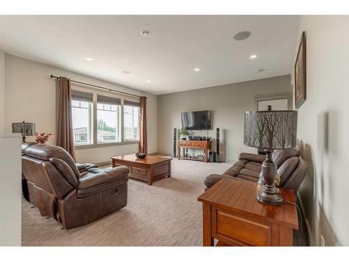 327 Prairie Garden Way South, Lethbridge, AB - Indoor Photo Showing Other Room With Fireplace