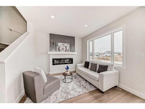 812 Devonia Circle West, Lethbridge, AB - Indoor Photo Showing Living Room With Fireplace