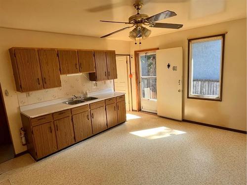 1919 7 Avenue North, Lethbridge, AB - Indoor Photo Showing Kitchen With Double Sink