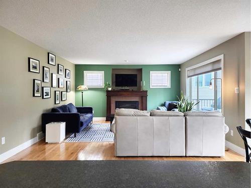 535 Couleesprings Crescent South, Lethbridge, AB - Indoor Photo Showing Living Room With Fireplace