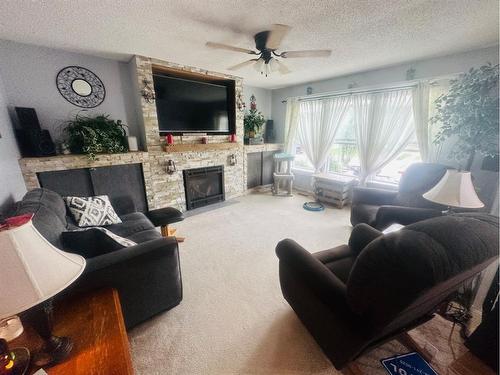 630 10 Street, Fort Macleod, AB - Indoor Photo Showing Living Room With Fireplace