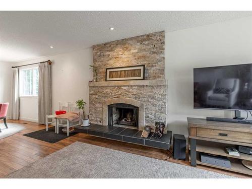 1505 Cedar Place South, Lethbridge, AB - Indoor Photo Showing Living Room With Fireplace