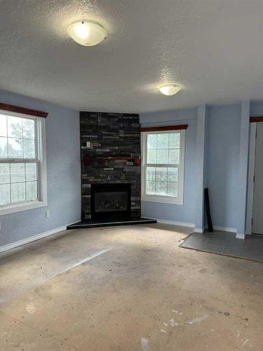 5414 Range Road 2-1A, Rural Pincher Creek No. 9, M.D. Of, AB - Indoor Photo Showing Living Room With Fireplace