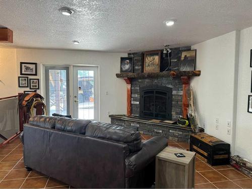 5414 Range Road 2-1A, Rural Pincher Creek No. 9, M.D. Of, AB - Indoor Photo Showing Living Room With Fireplace