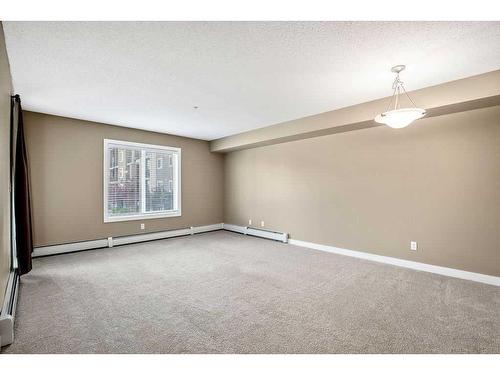 9208-403 Mackenzie Way Sw, Airdrie, AB - Indoor Photo Showing Other Room