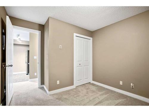 9208-403 Mackenzie Way Sw, Airdrie, AB - Indoor Photo Showing Other Room