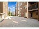 9208-403 Mackenzie Way Sw, Airdrie, AB  - Outdoor With Balcony With Exterior 