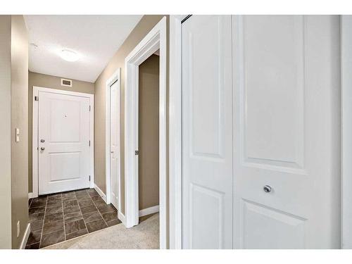 9208-403 Mackenzie Way Sw, Airdrie, AB - Indoor Photo Showing Other Room