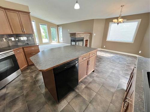 188 Riverstone Boulevard West, Lethbridge, AB - Indoor Photo Showing Kitchen With Fireplace