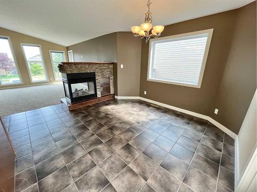 188 Riverstone Boulevard West, Lethbridge, AB - Indoor Photo Showing Living Room With Fireplace