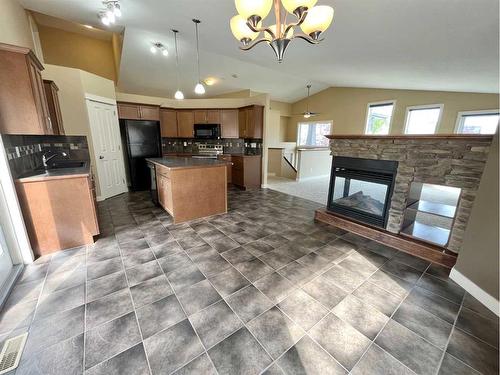 188 Riverstone Boulevard West, Lethbridge, AB - Indoor Photo Showing Other Room With Fireplace