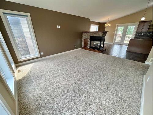 188 Riverstone Boulevard West, Lethbridge, AB - Indoor Photo Showing Living Room With Fireplace