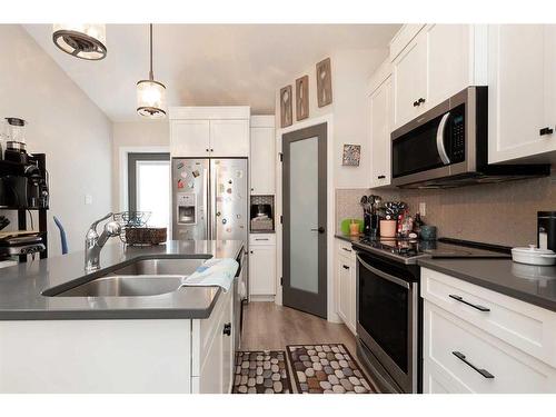 882 Greywolf Run North, Lethbridge, AB - Indoor Photo Showing Kitchen With Double Sink