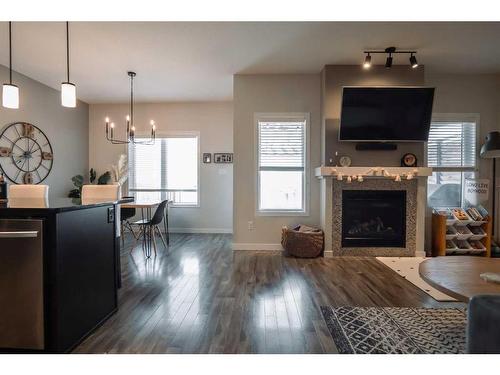 639 Keystone Chase West, Lethbridge, AB - Indoor Photo Showing Living Room With Fireplace