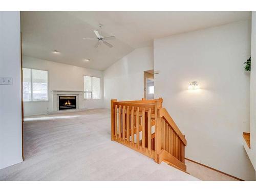 230 Mcmaster Boulevard West, Lethbridge, AB - Indoor Photo Showing Other Room With Fireplace