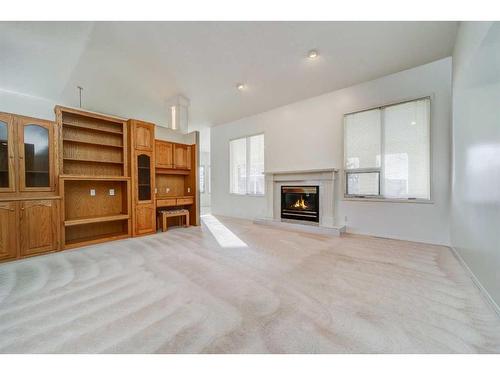 230 Mcmaster Boulevard West, Lethbridge, AB - Indoor Photo Showing Living Room With Fireplace