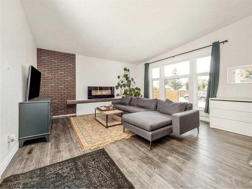 1803 22 Street South, Lethbridge, AB - Indoor Photo Showing Living Room With Fireplace