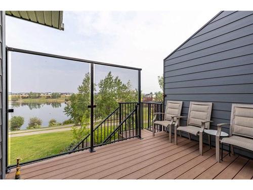 4-53 Aquitania Circle West, Lethbridge, AB - Outdoor With Body Of Water With Deck Patio Veranda With Exterior